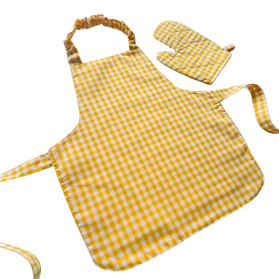 A child’s apron and matching oven mitt set. Pattern is yellow and white gingham.