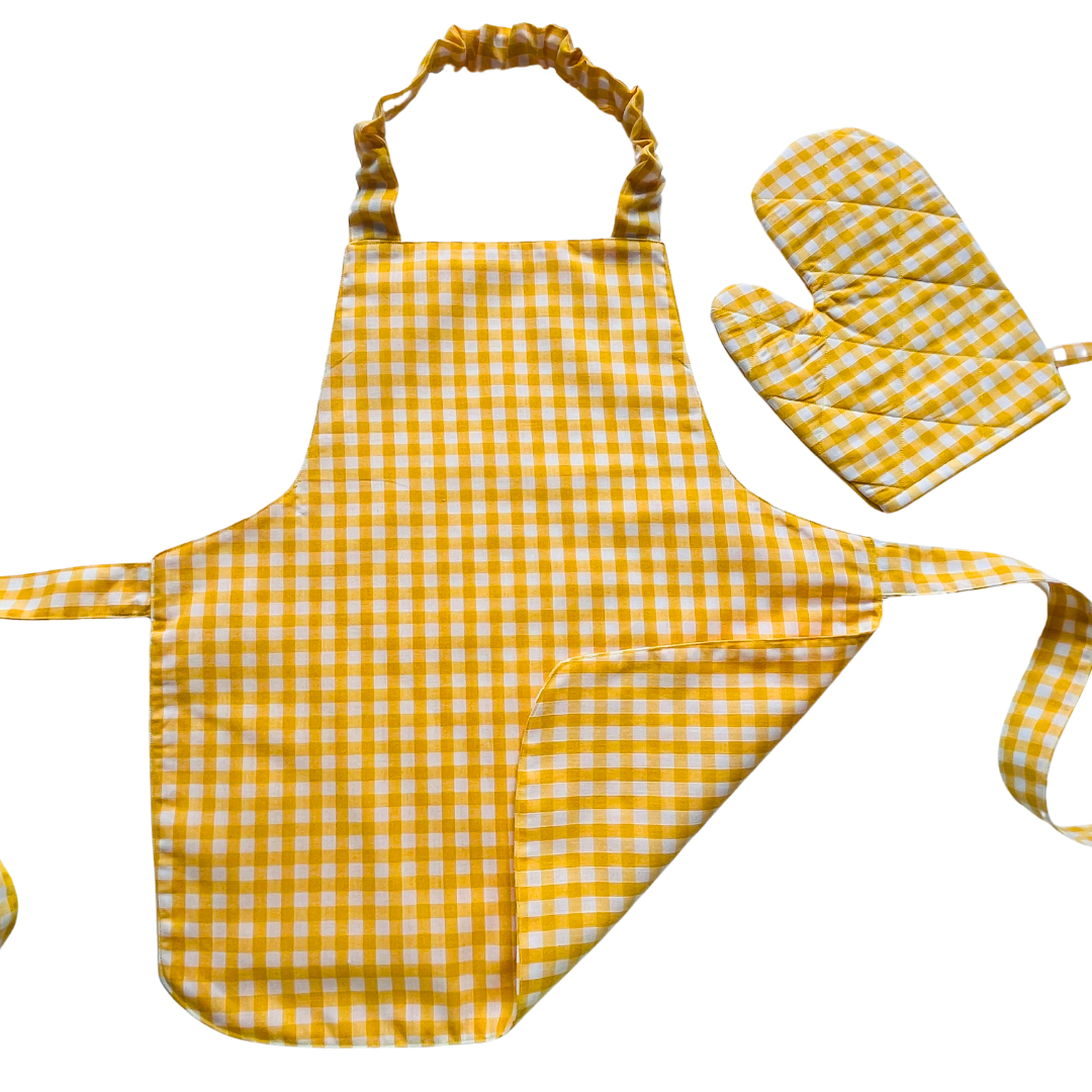 A child’s apron and matching oven mitt set. Pattern is yellow and white gingham.
