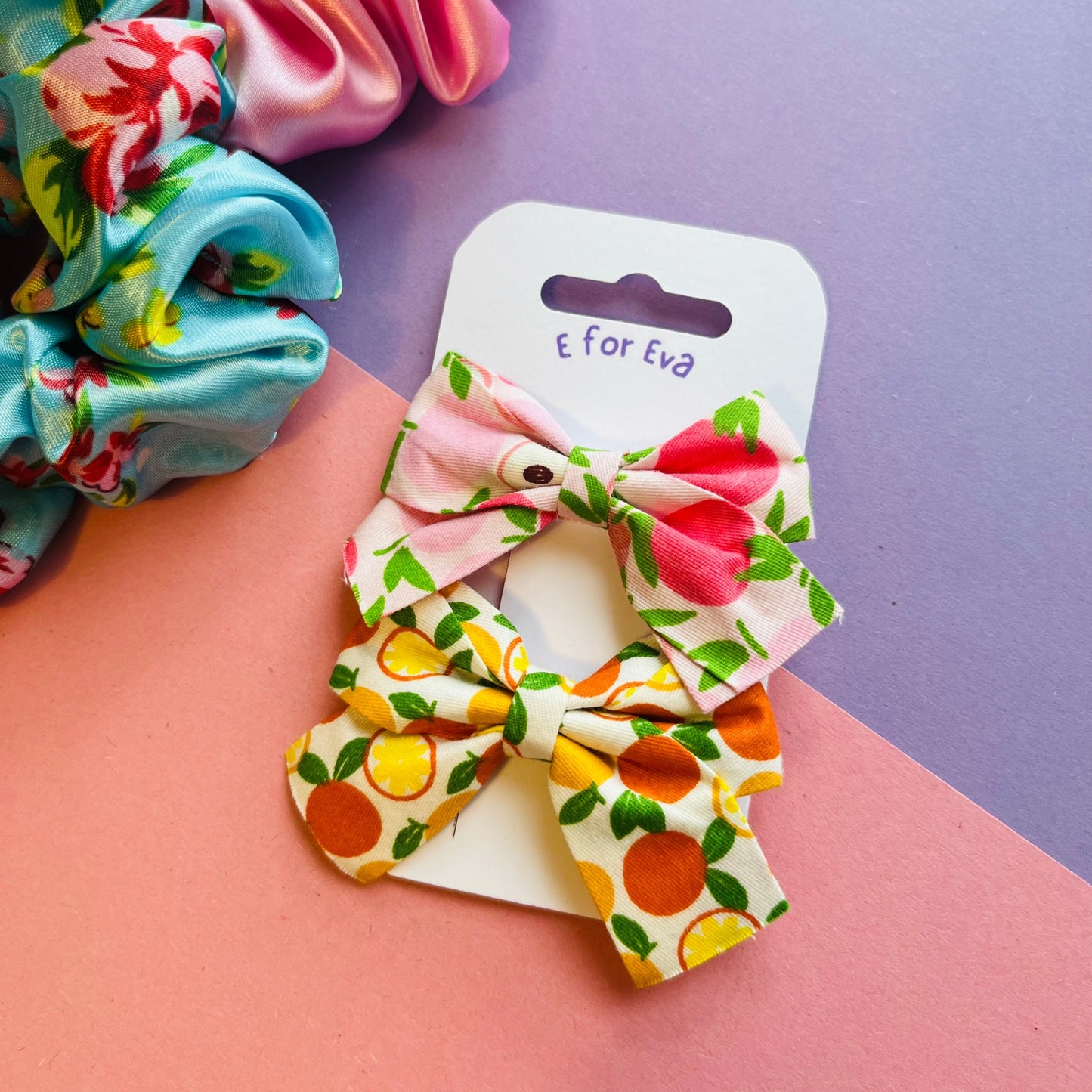Apple and Orange bow hair clips E for Eva