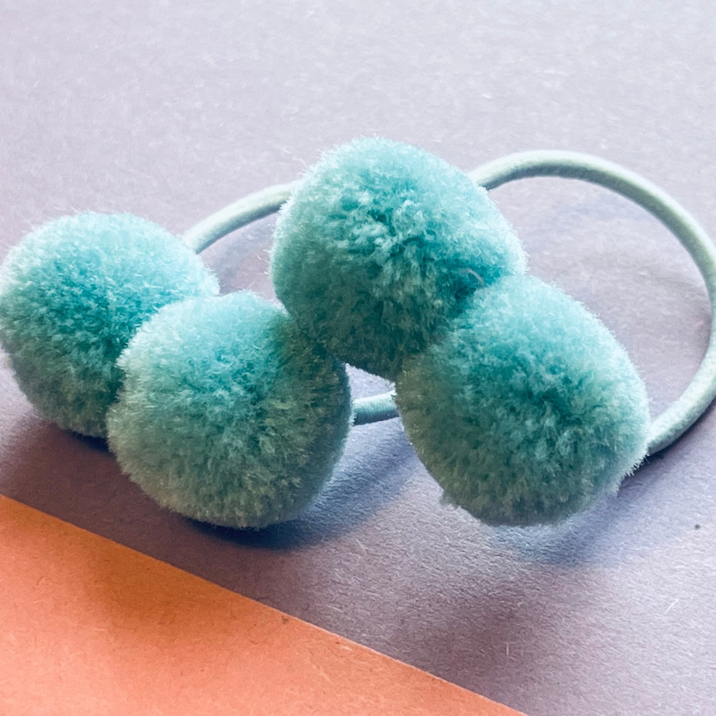 Blue pompom hair ties E for Eva