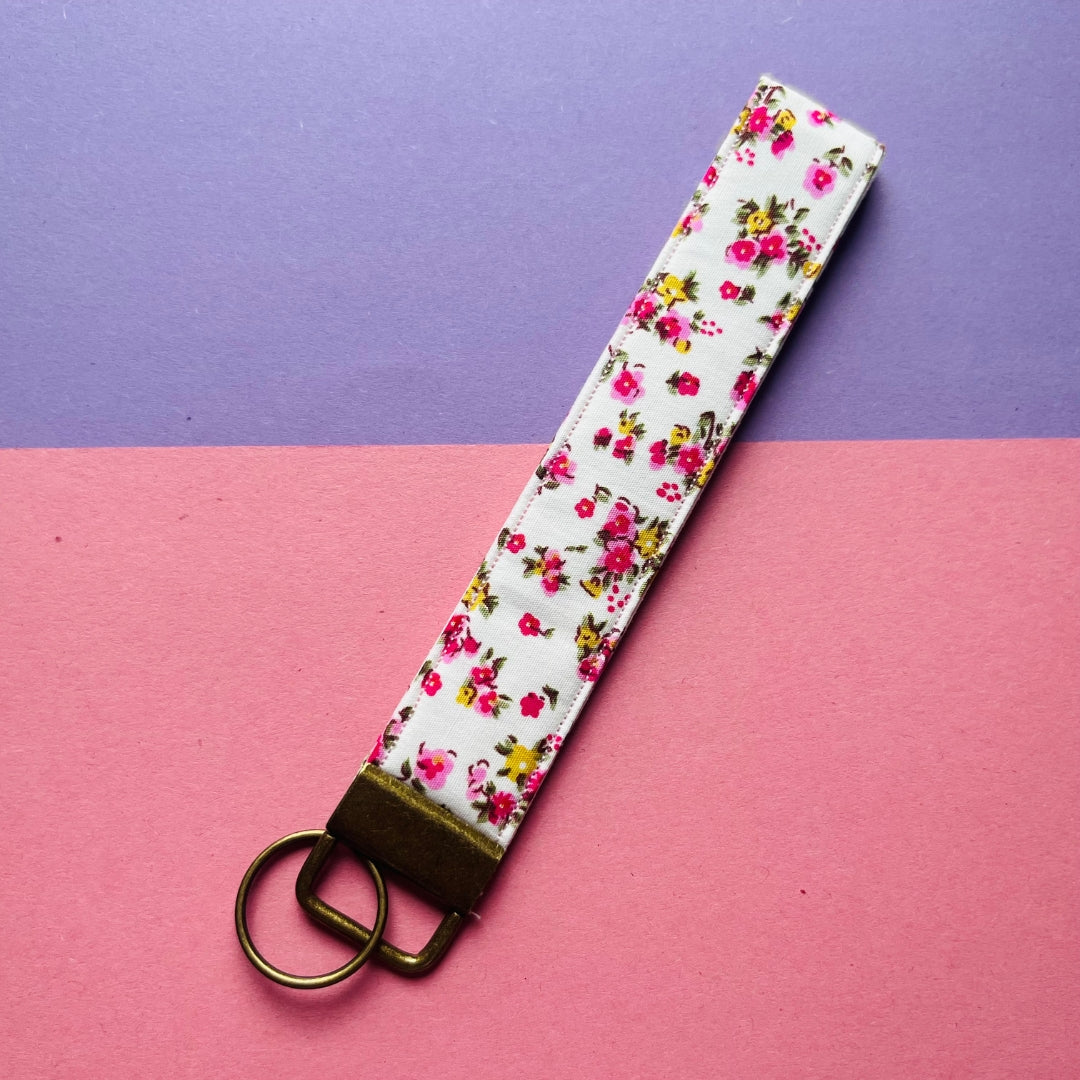 matching pink floral print purse and key fob wristlet