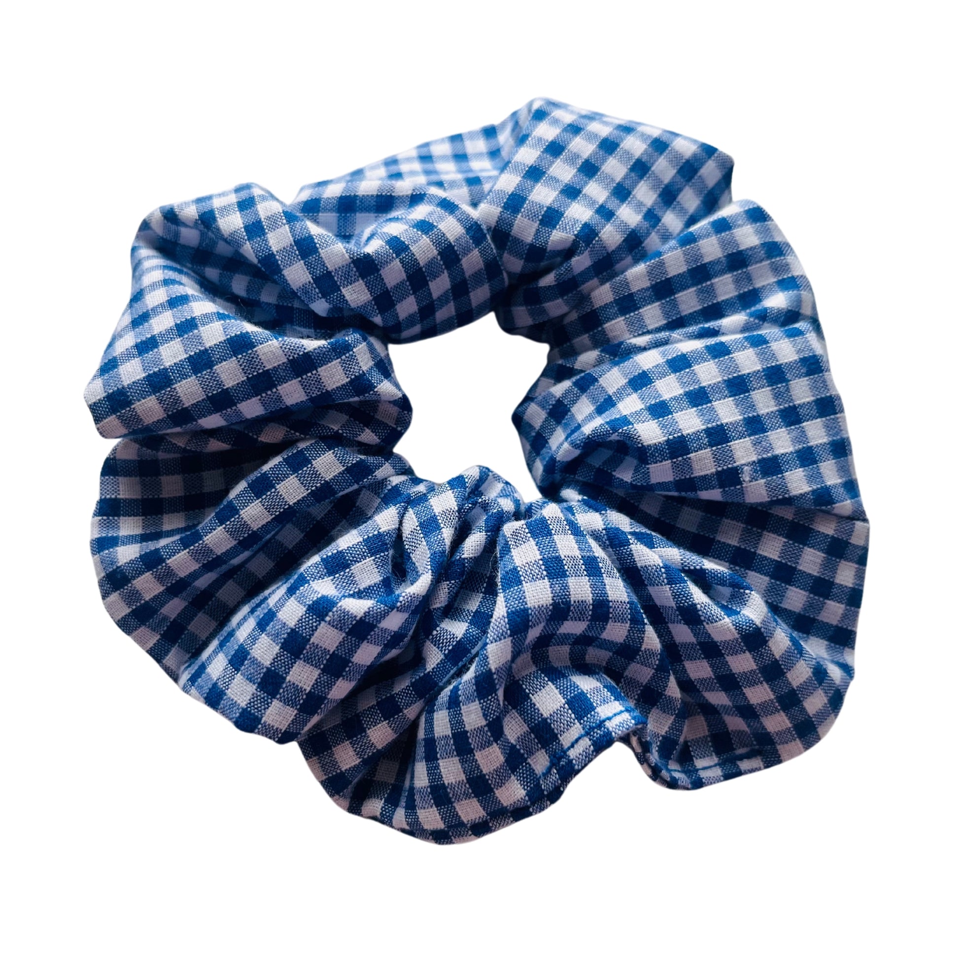 Angled view of blue gingham school hair scrunchie E for Eva