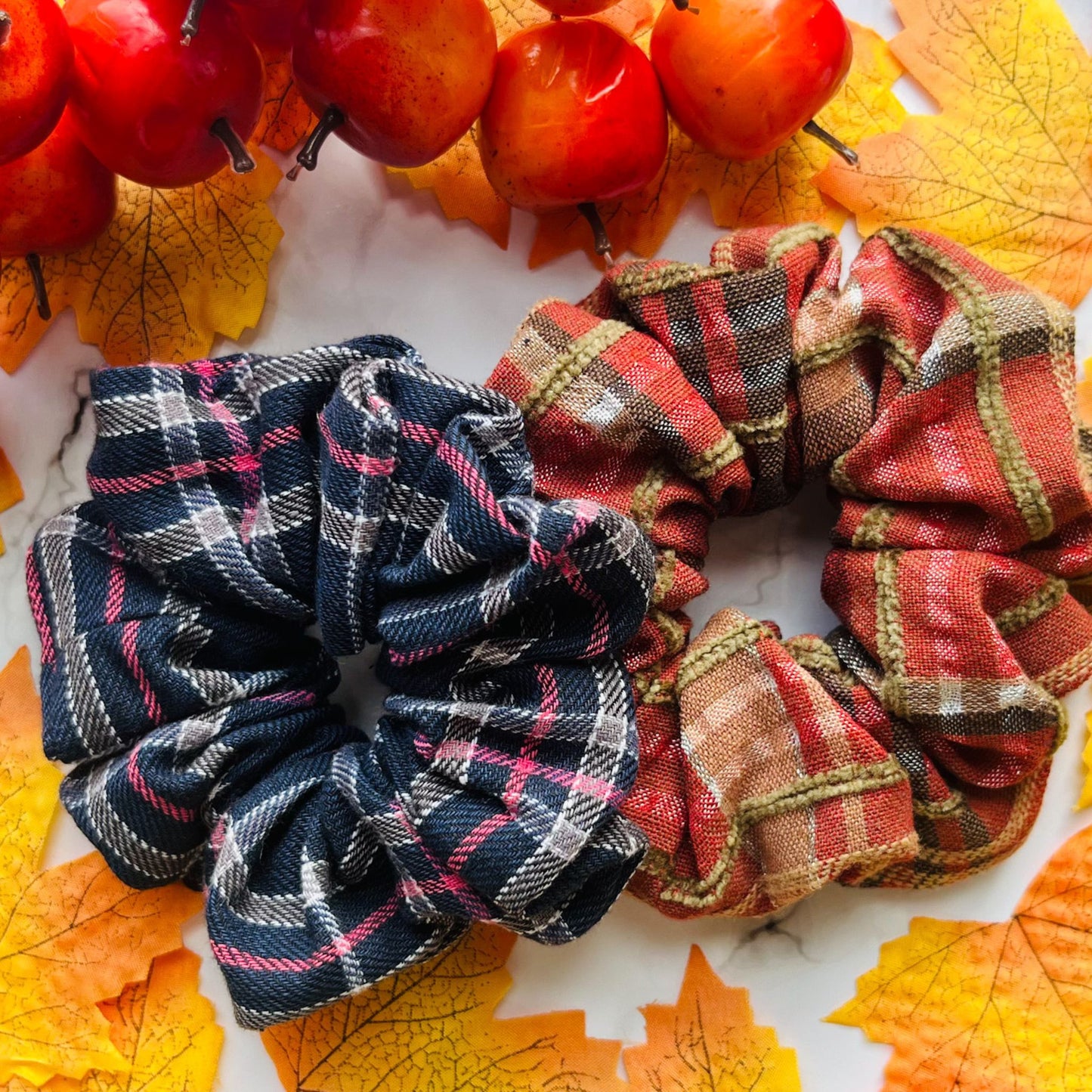 styled overview of blue and red tartan hair scrunchies Cotton E for Eva