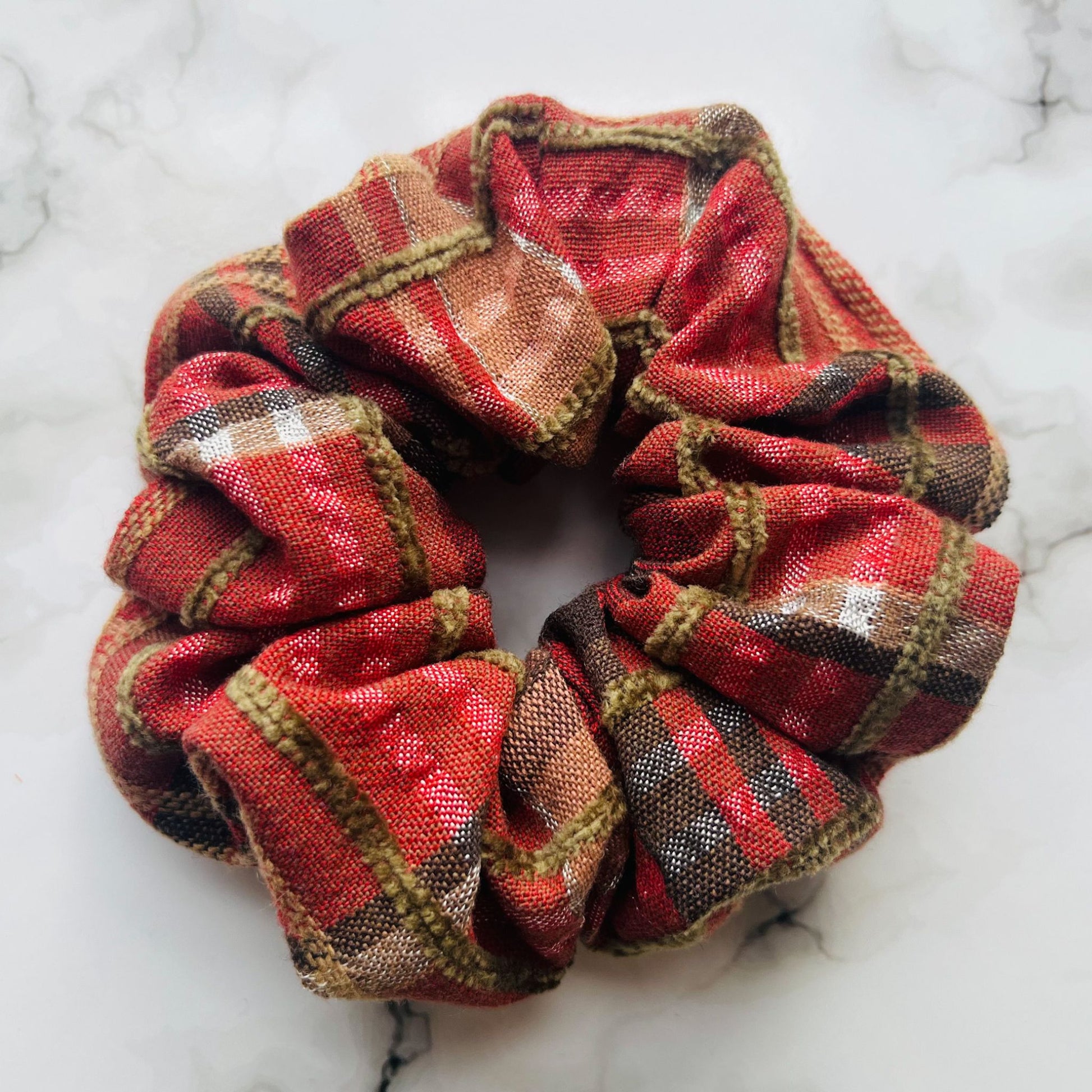 Close up of red tartan hair scrunchie cotton E for Eva