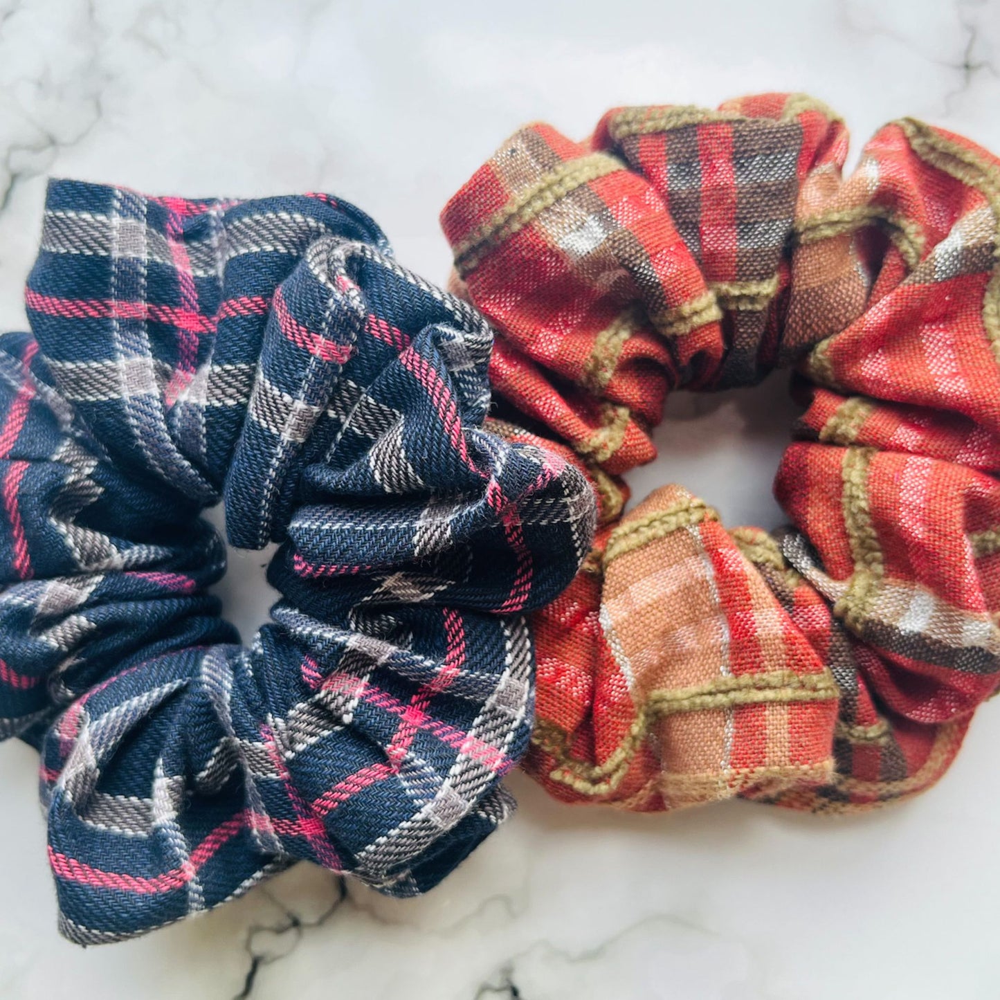 Overview of red and blue tartan hair scrunchies Cotton E for Eva
