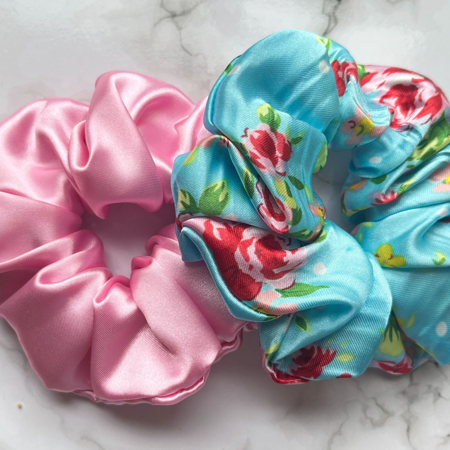 Overview of blue floral and pink scrunchies satin E for Eva