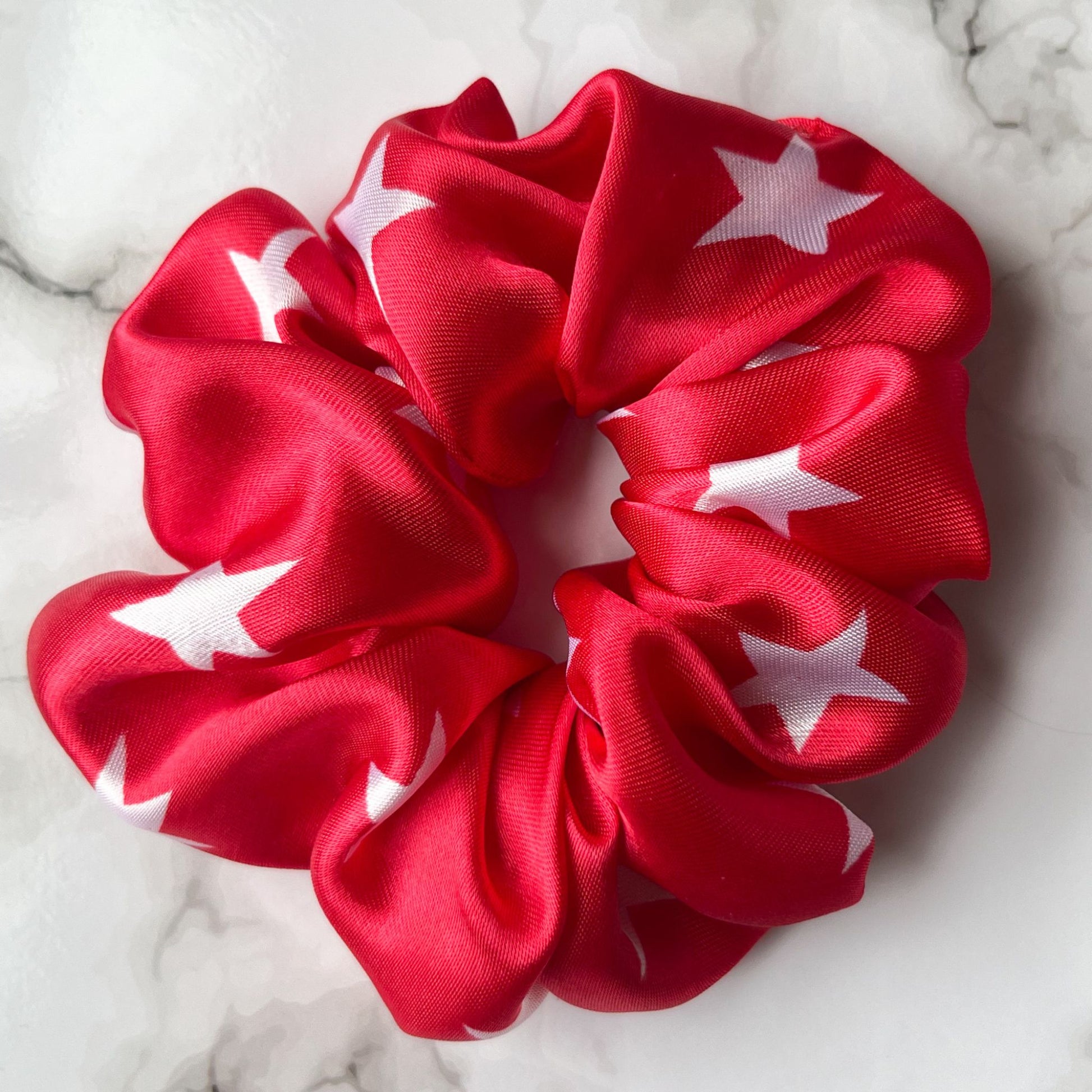 Close up of red stars hair scrunchie satin E for Eva