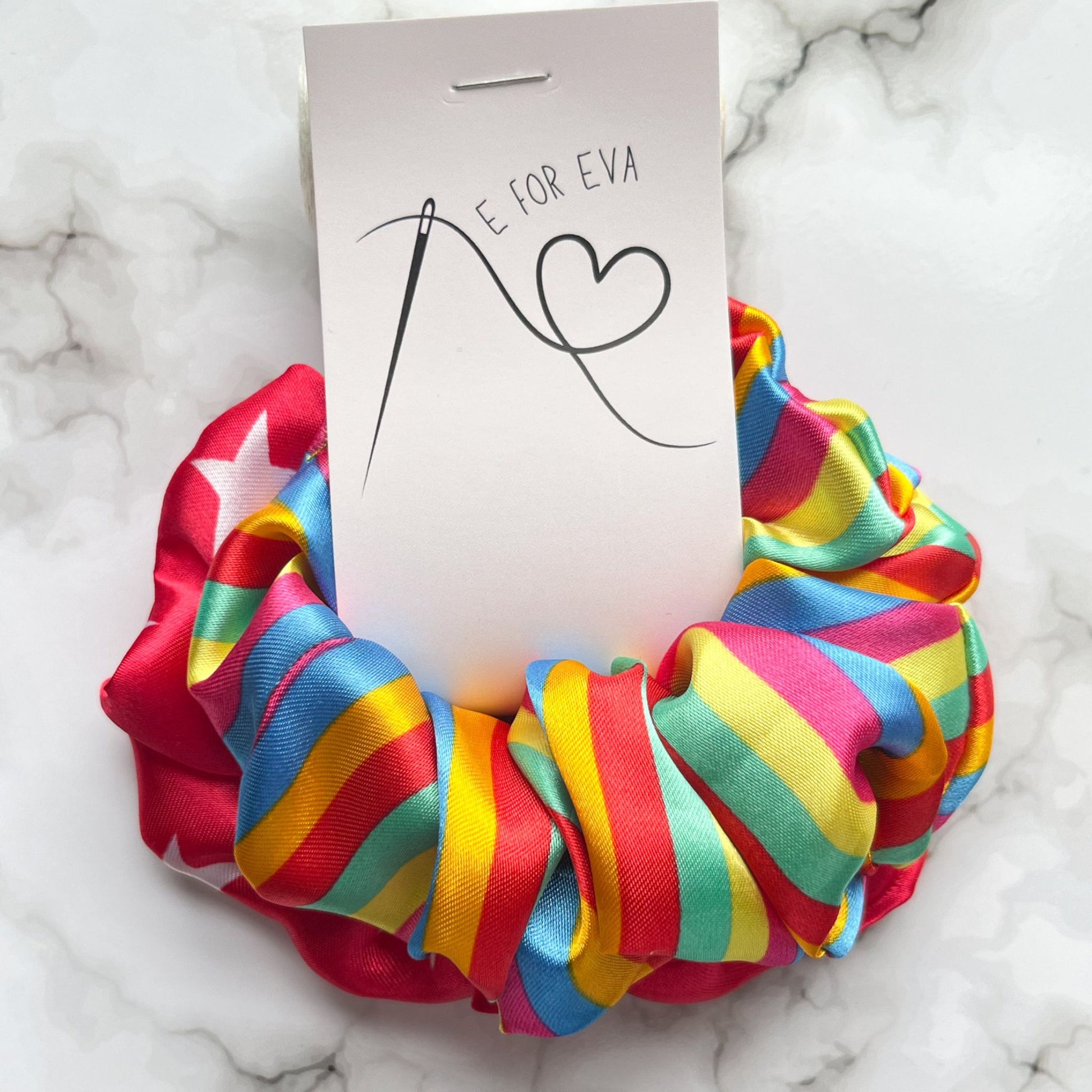 Tagged view of circus stars stripes rainbow hair scrunchies satin E for Eva