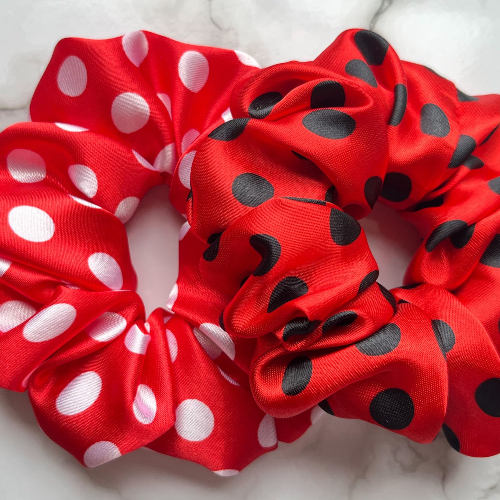 Overview of red black and white spots hair scrunchies satin E for Eva