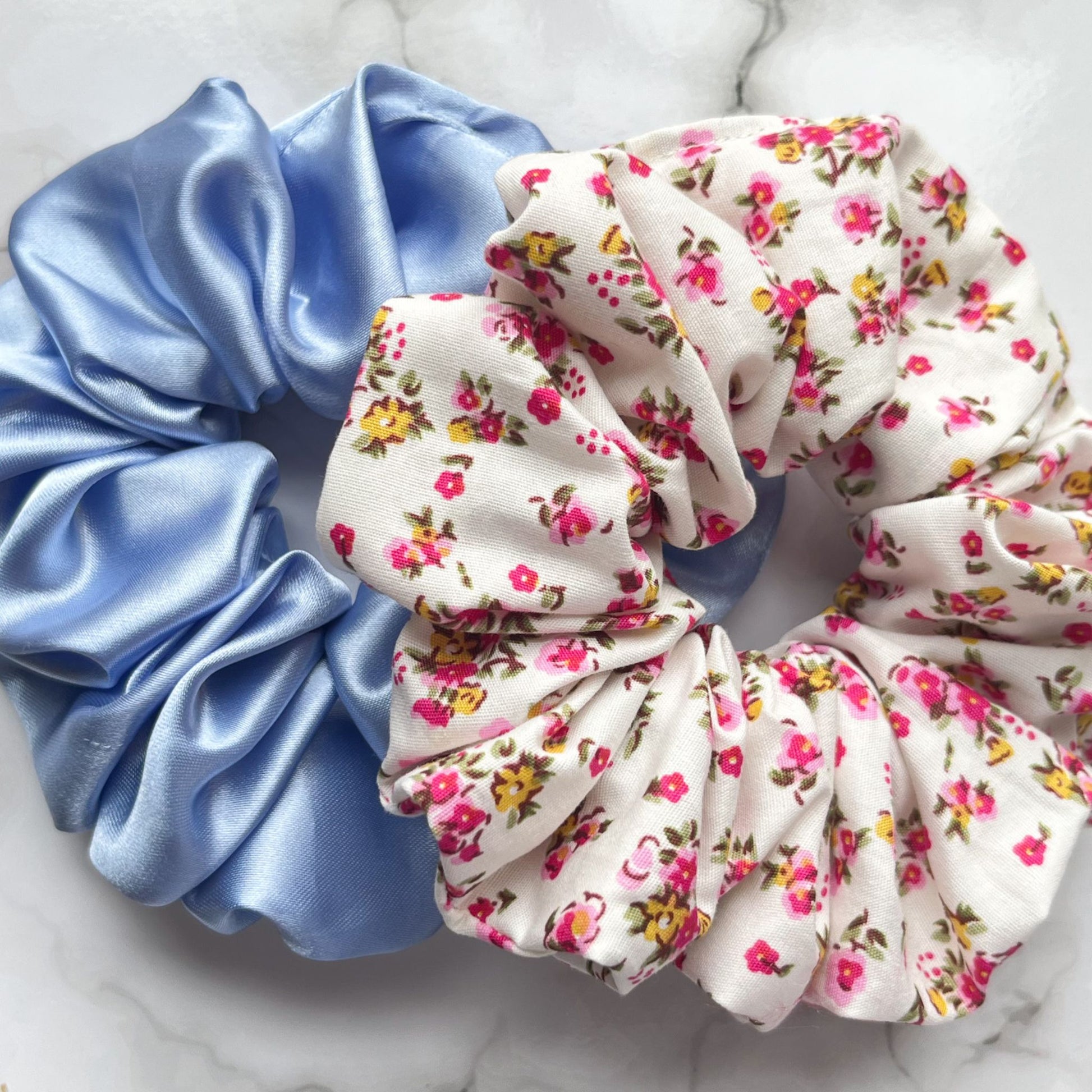 Overview of blue and pink floral hair scrunchies cotton satin E for Eva