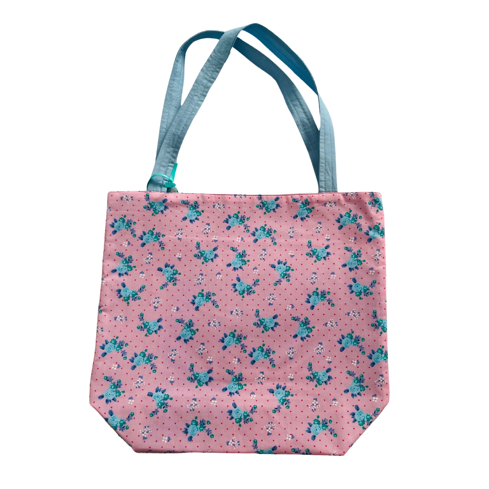 Flat view of pink and blue floral tote bag