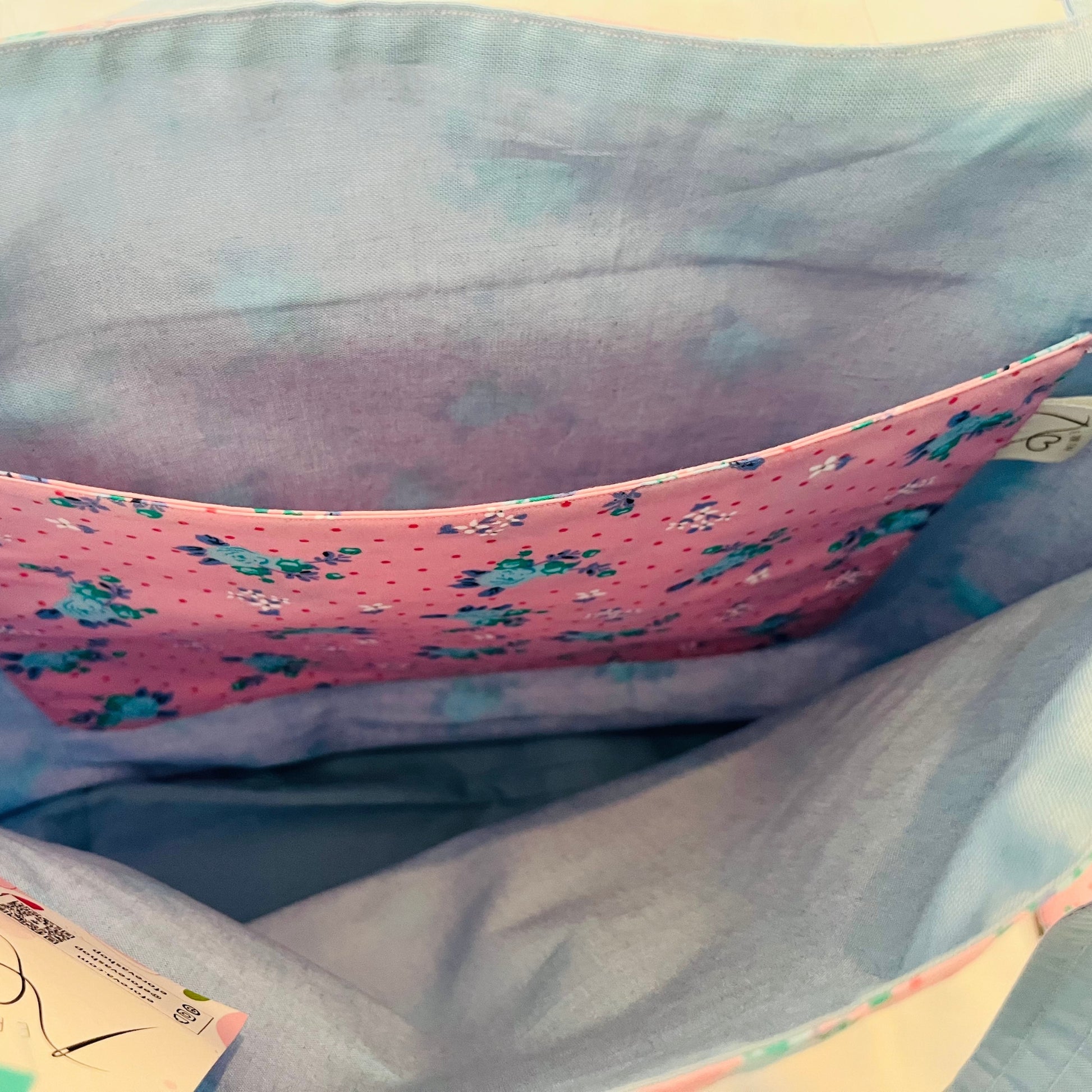 Close up of pink and blue floral tote bag's inside pocket