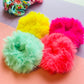 Shot of all neon fur scrunchies