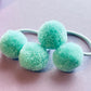 Aqua pompom hair ties E for Eva