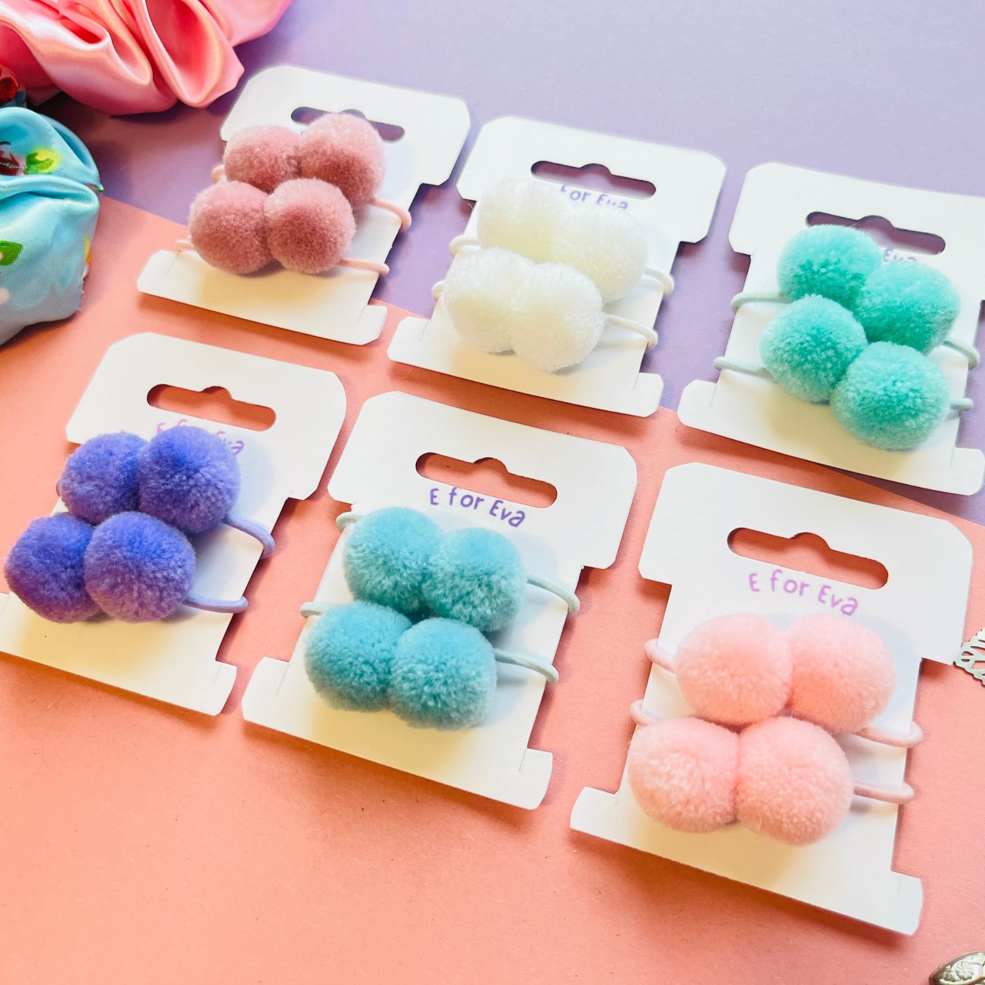 Tagged pompom hair ties E for Eva