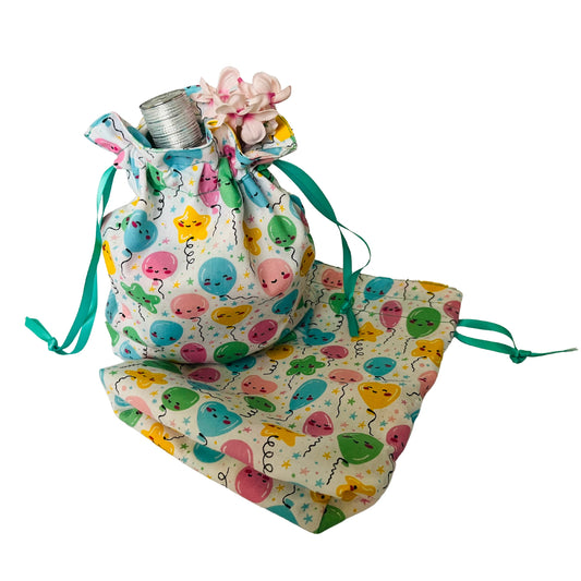 Styled view of birthday drawstring gift bag