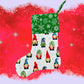 Styled view of christmas gonk green stocking E for Eva