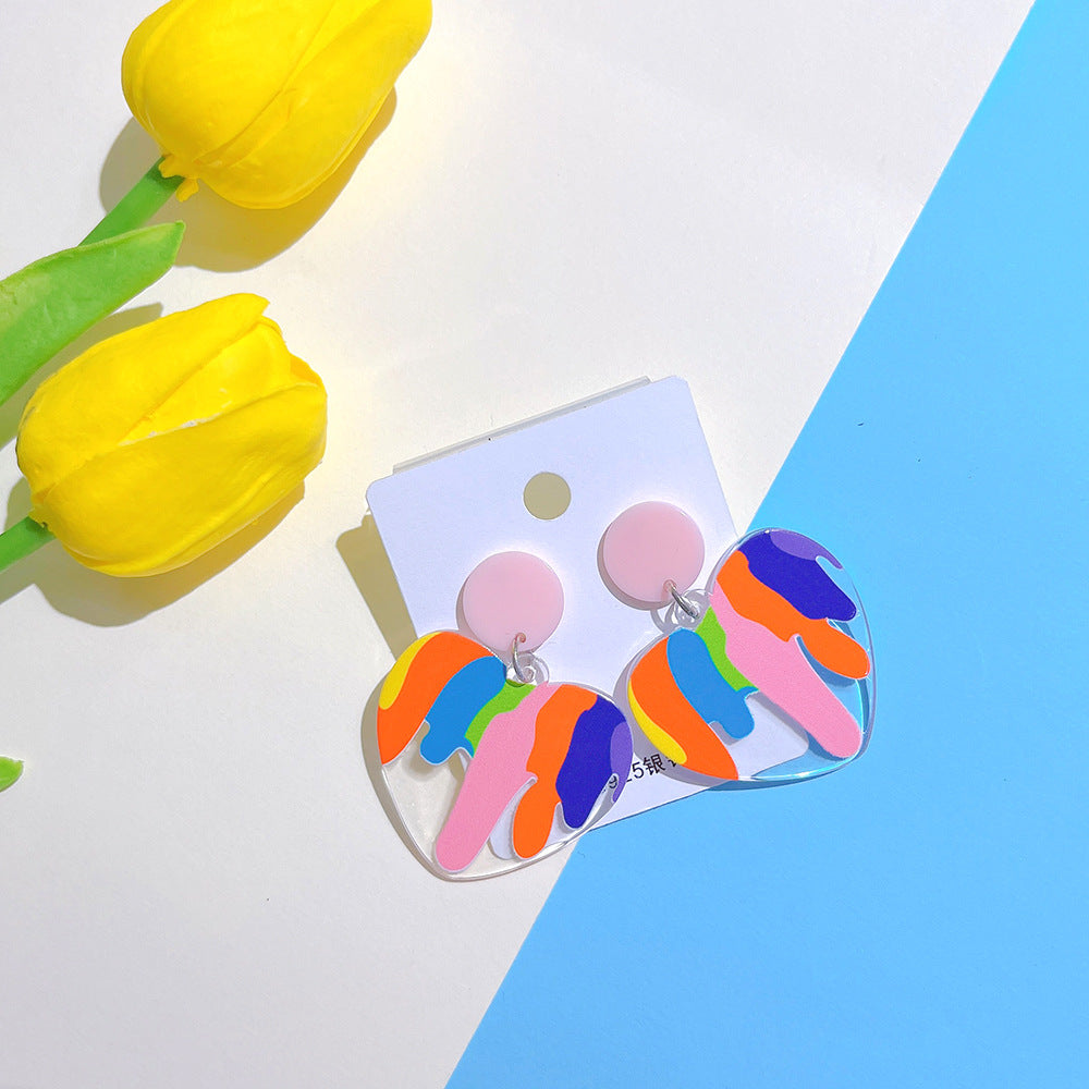Styled overview of heart acrylic earrings E for Eva