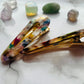 Styled side view of white geometric hair clips E for Eva