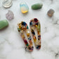 Styled overview of white geometric hair clips E for Eva