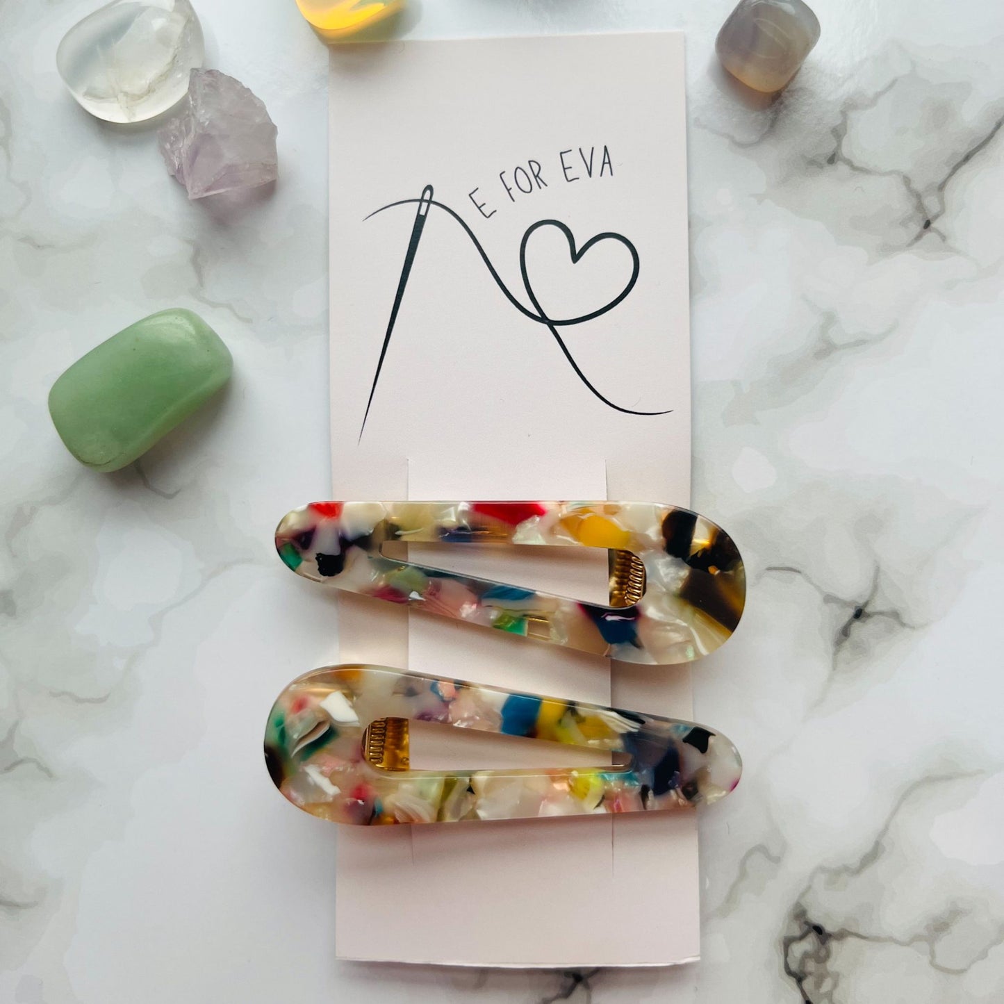 Styled tagged view of white geometric hair clips E for Eva